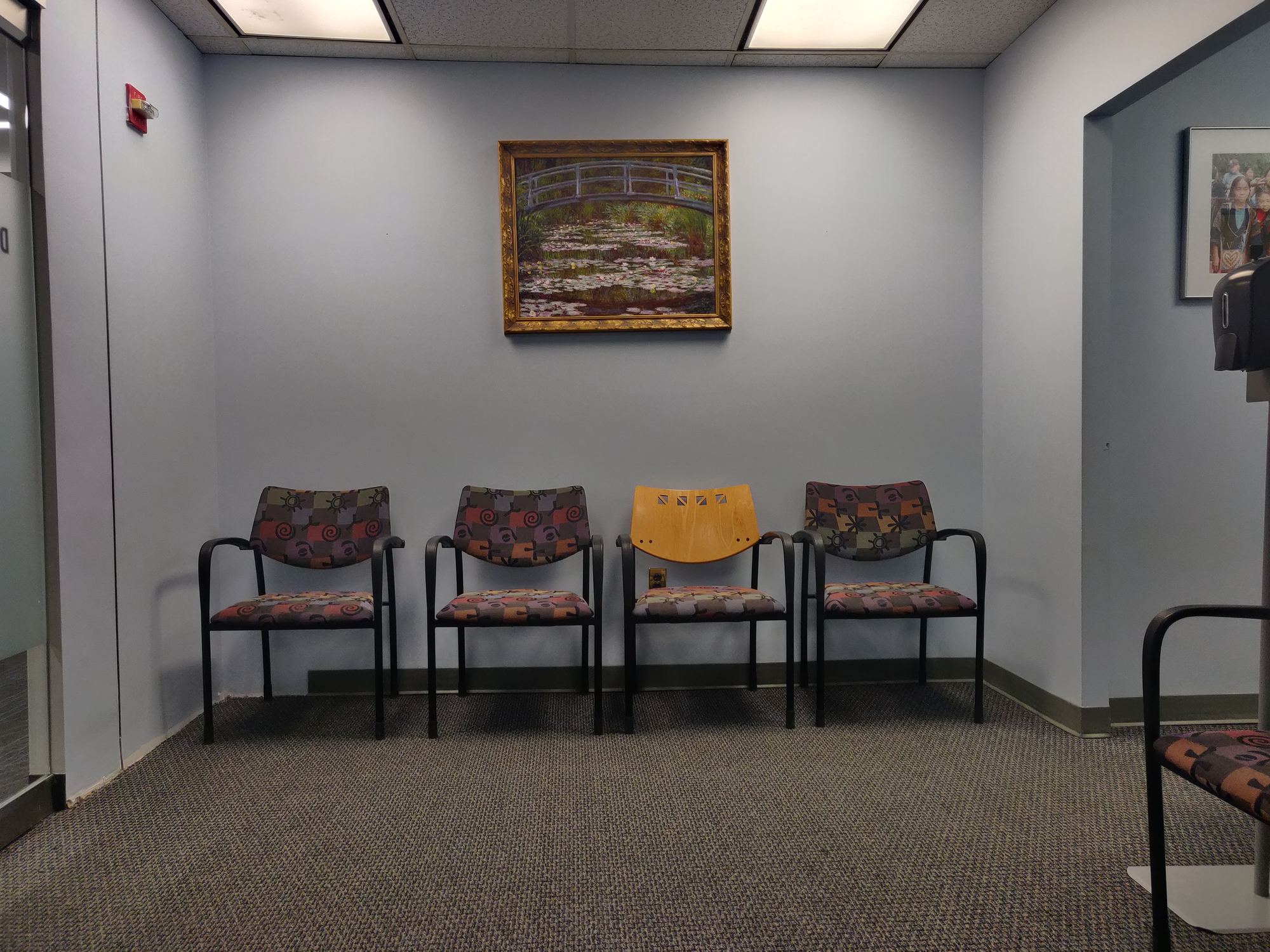 Calm, well-lit medical practice waiting room